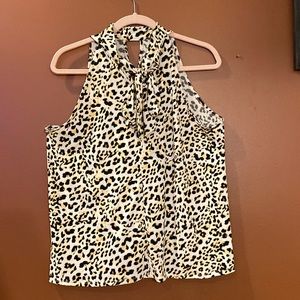 Sleeveless leopard print ladies blouse in size large. Tie front.